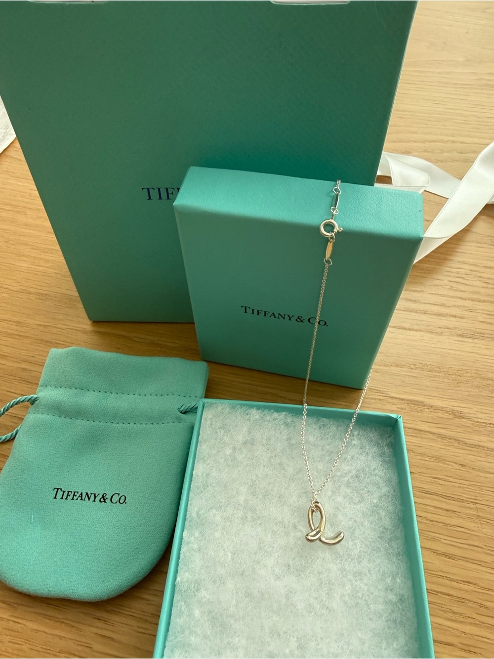 Tiffany & Co. Sterling Silver Script 'L' Pendant Necklace with Blue Packaging